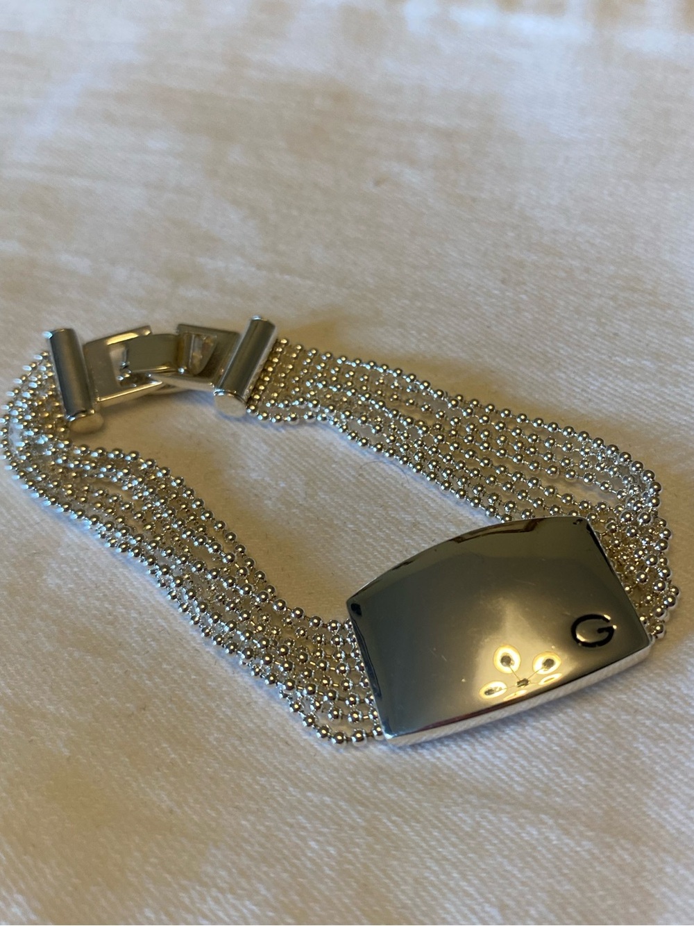 Guess polished silver tone bracelet